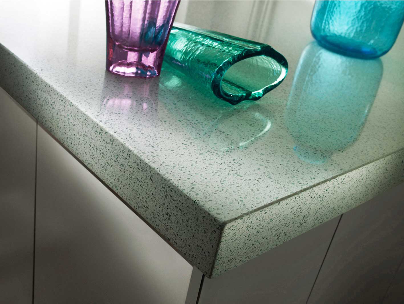 You can see flecks of glass in the material, which give it a reflective quality You can see flecks of glass in the material, which give it a reflective quality